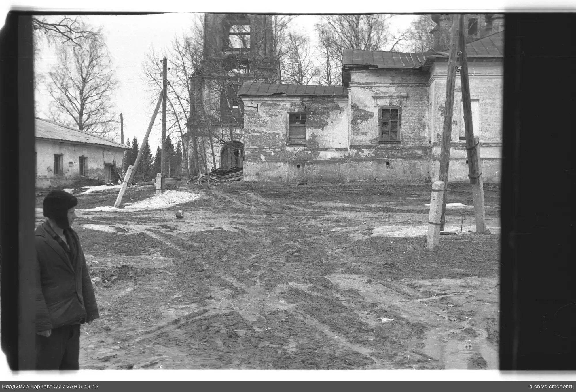 Man near brick buildings
