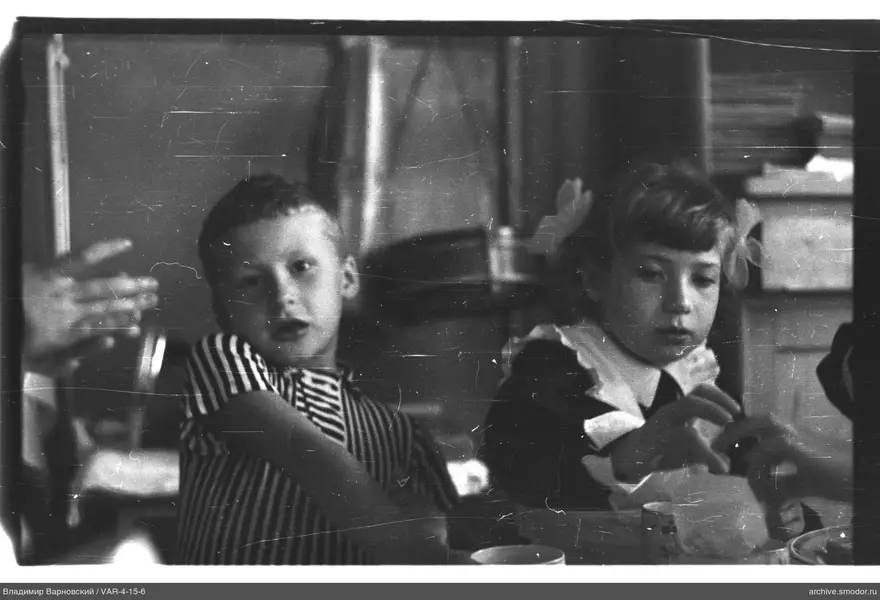 Two children sitting at a table