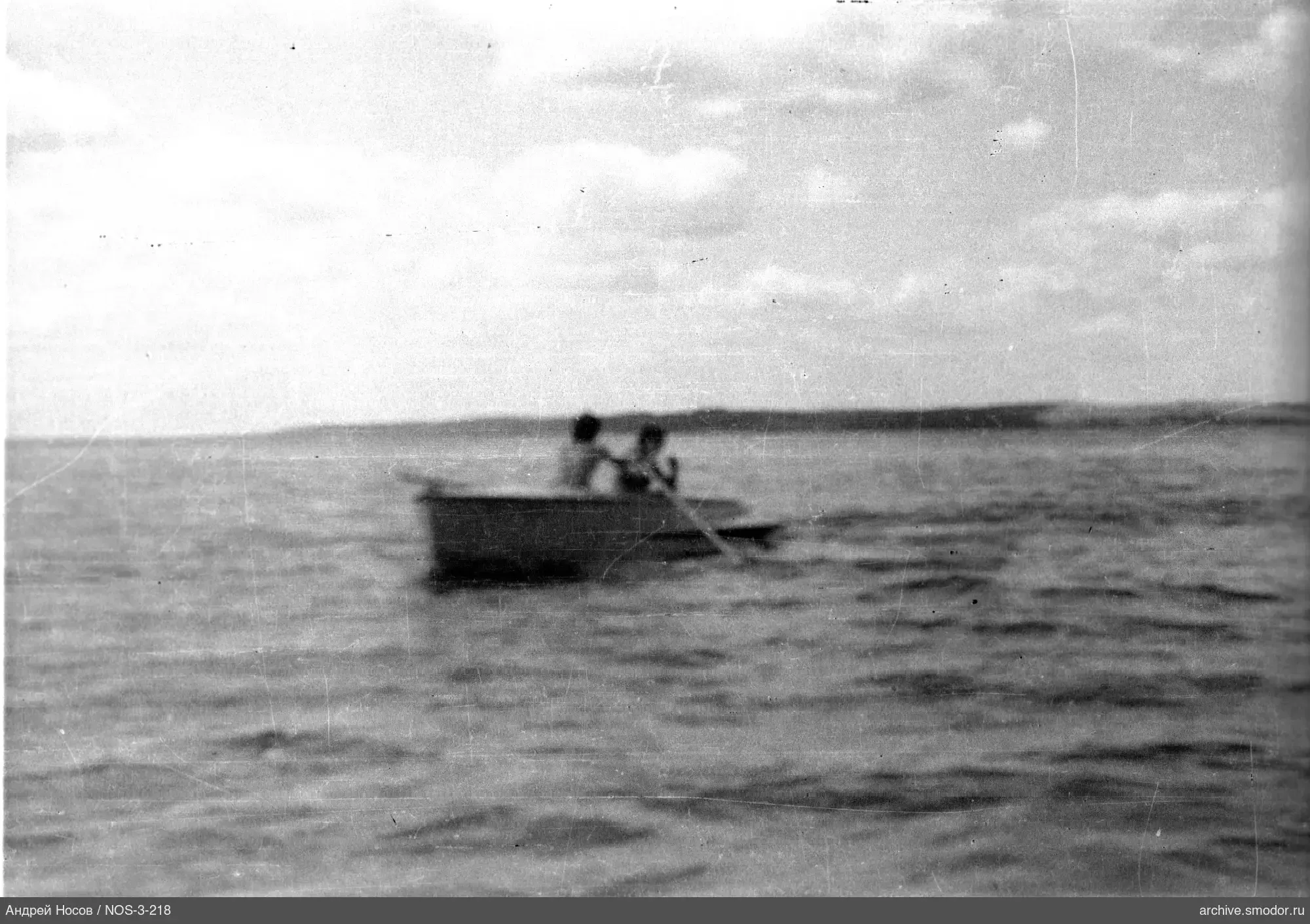 Boat with two people on the water