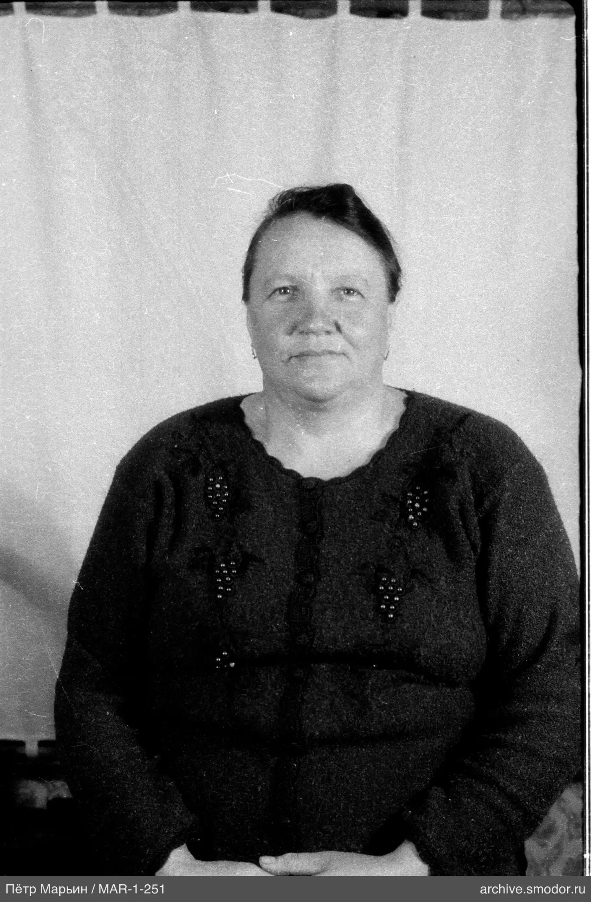 Portrait of a woman in a dark cardigan