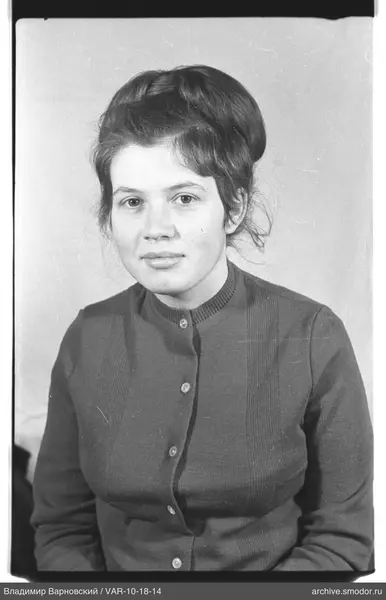 Portrait of a woman in a dark cardigan