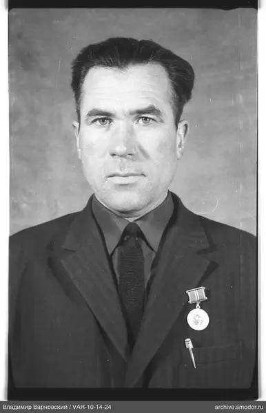 Portrait of a man in a dark suit