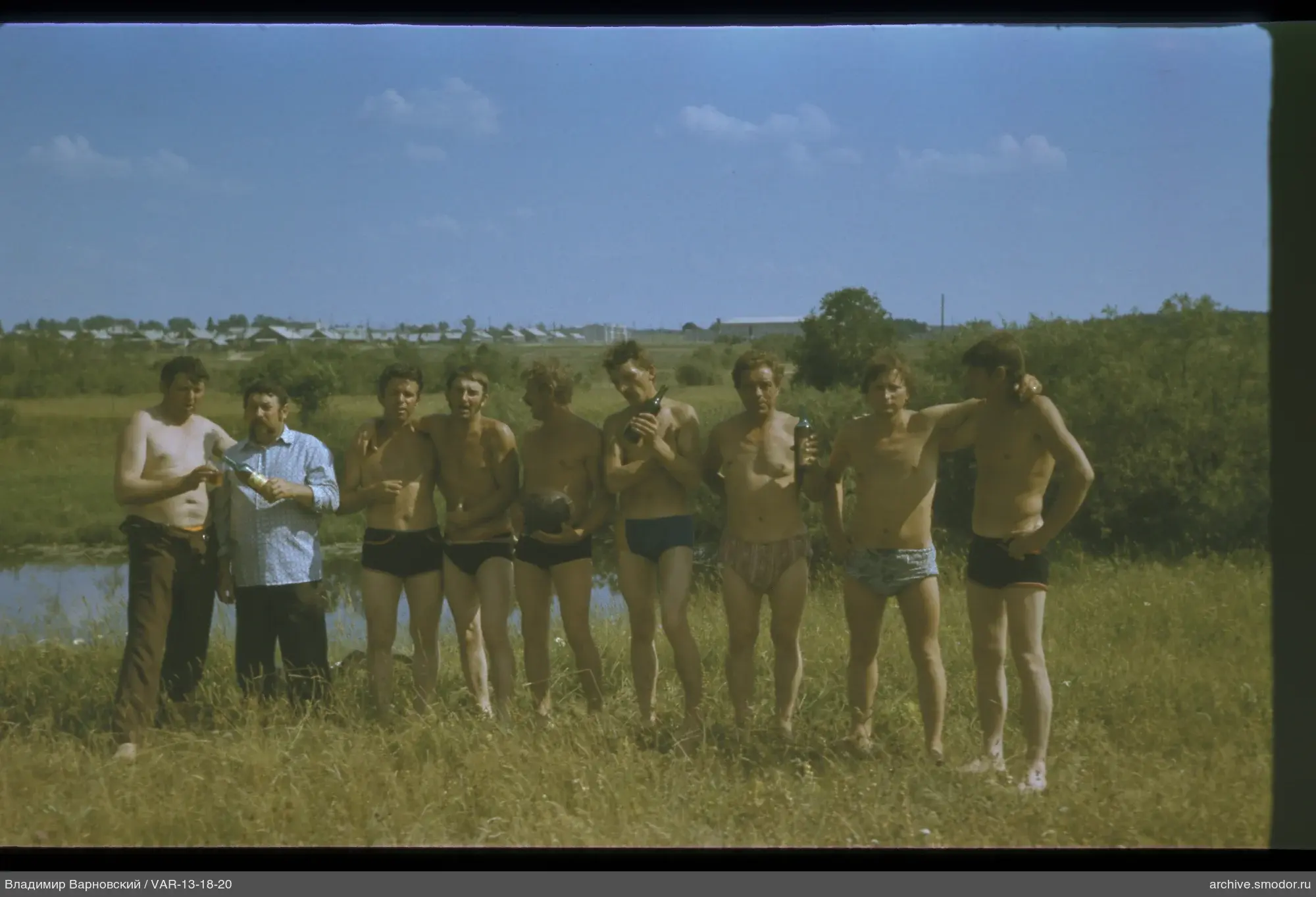 Group of men by the water