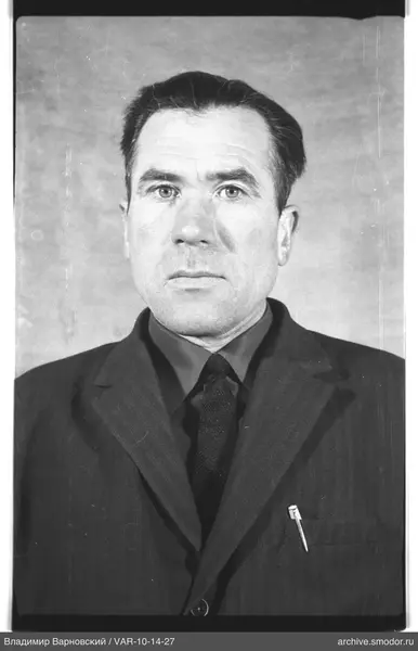 Portrait of a man in a dark suit