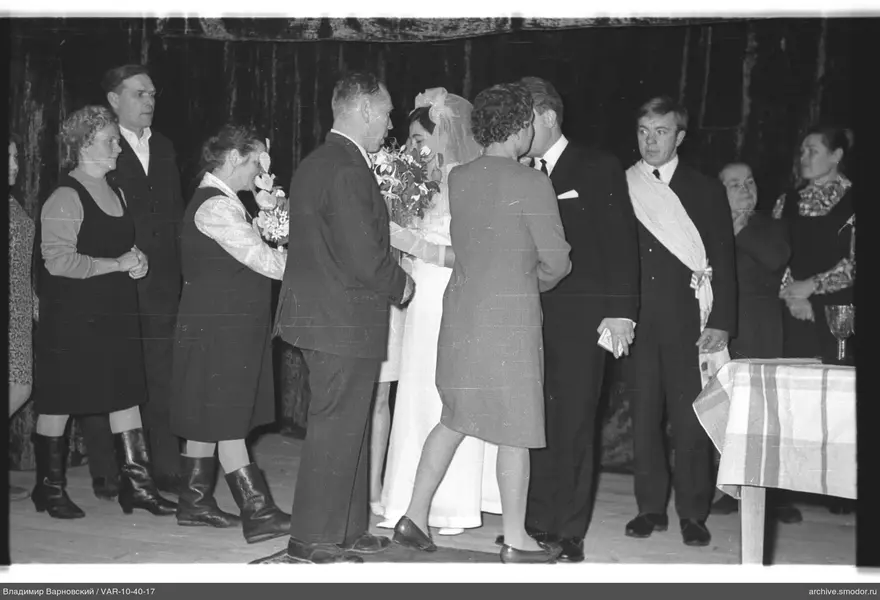 Group photo with woman in white dress
