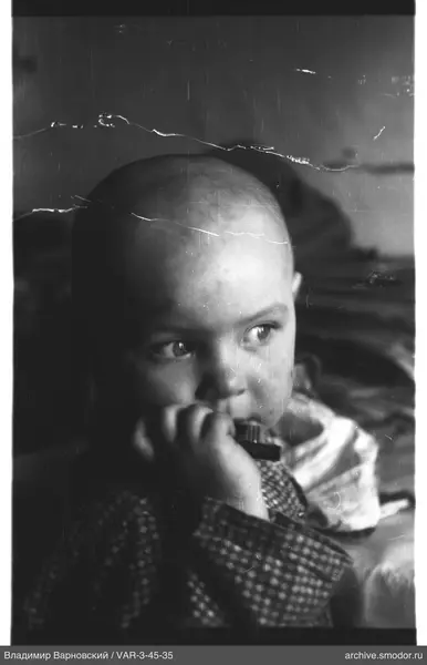 Child with object near mouth