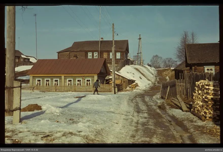 Village street with houses and a man