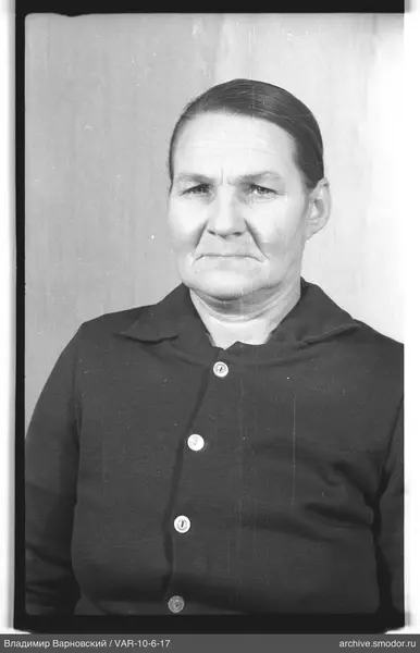 Portrait of a woman in a dark cardigan