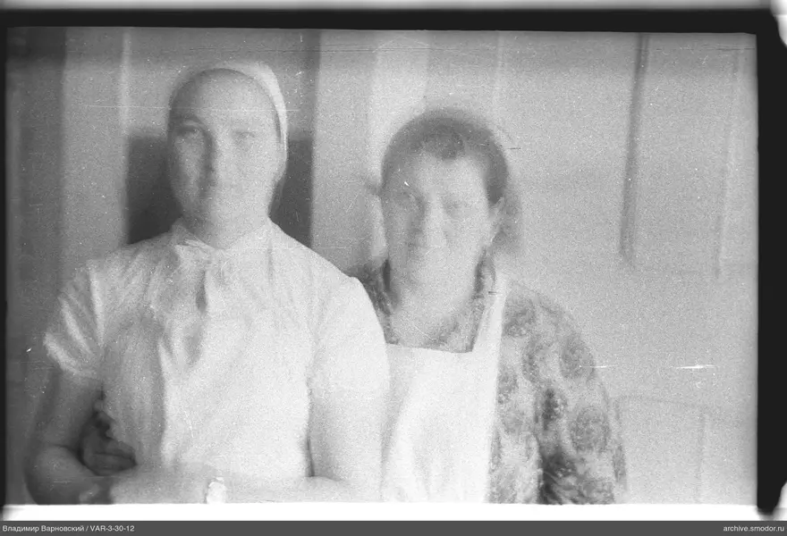 Two women in group portrait