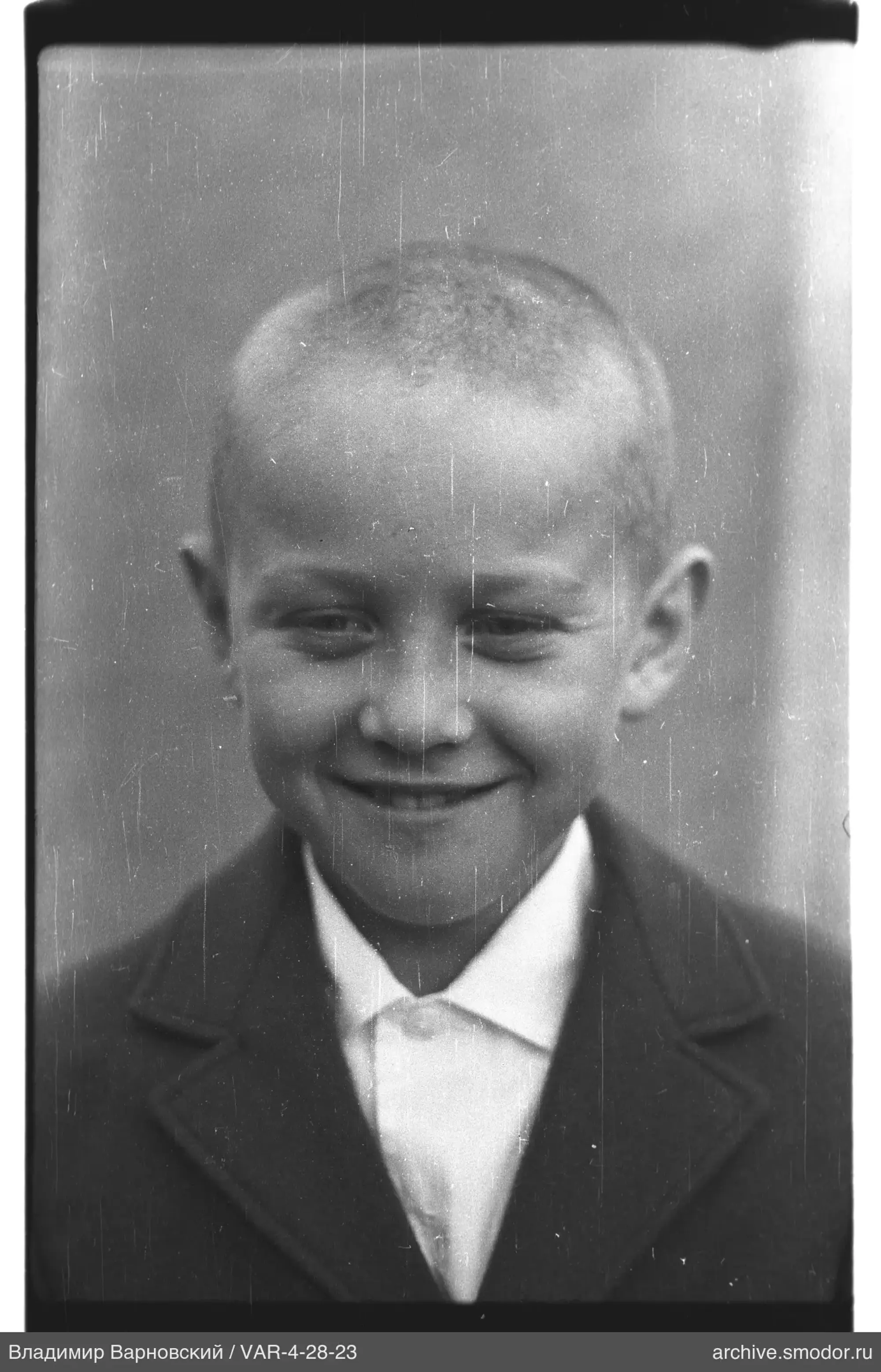 Portrait of a boy in a dark jacket