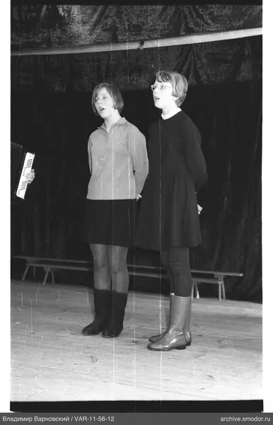Two women singing on stage