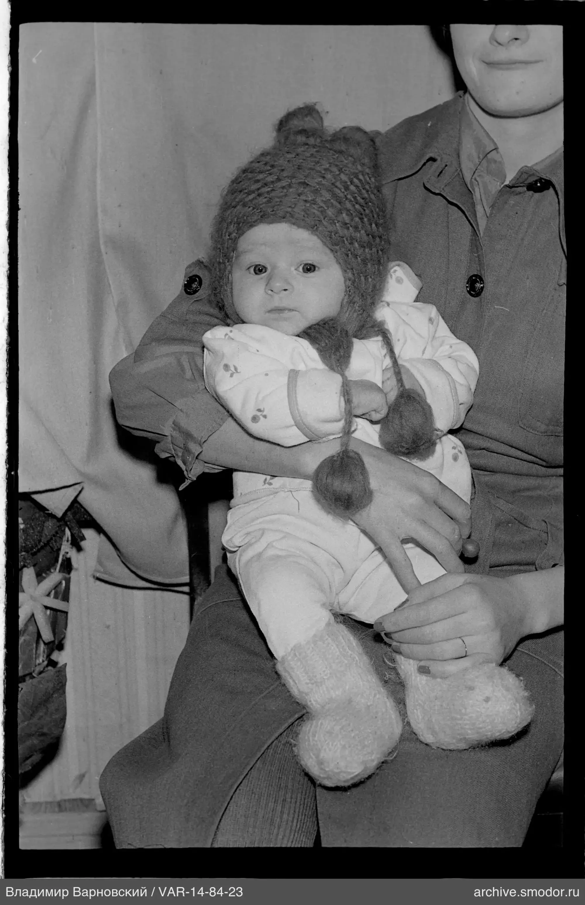 Child in adult's arms