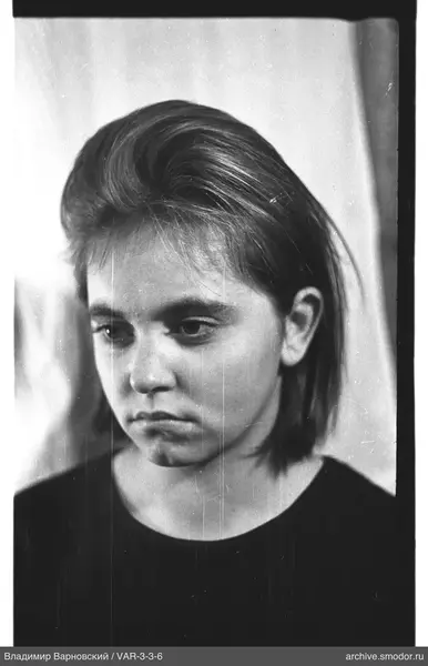 Bust portrait of a woman with short light hair