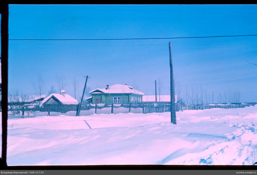 Wooden house in snow