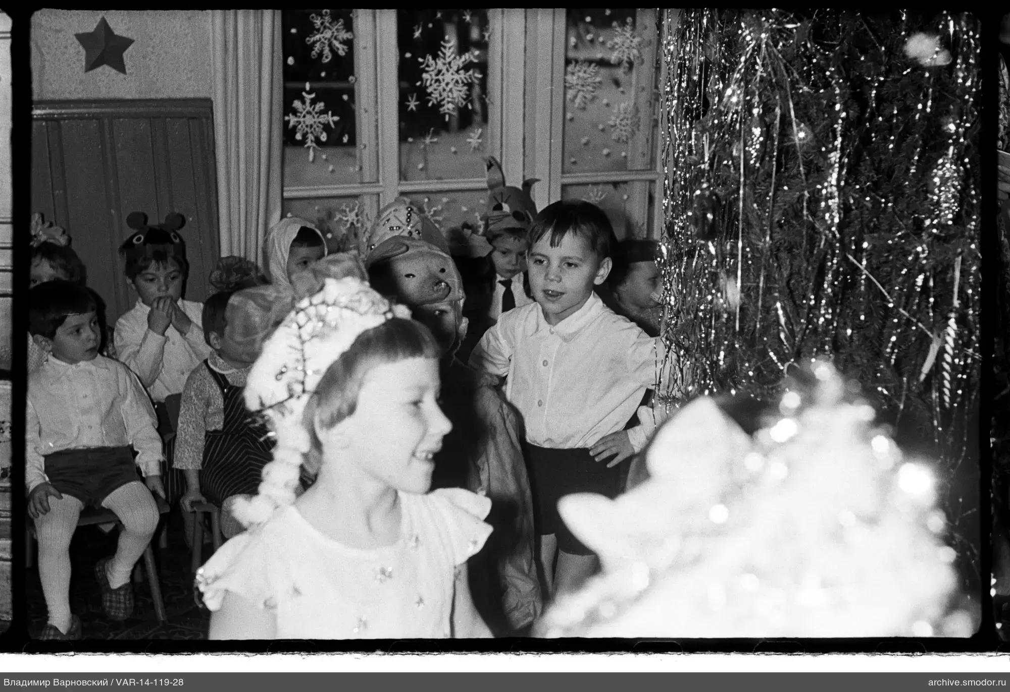 Group of children with decorated Christmas tree