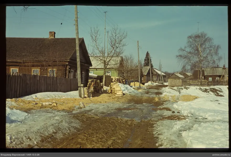 Wooden houses and dirt road scene