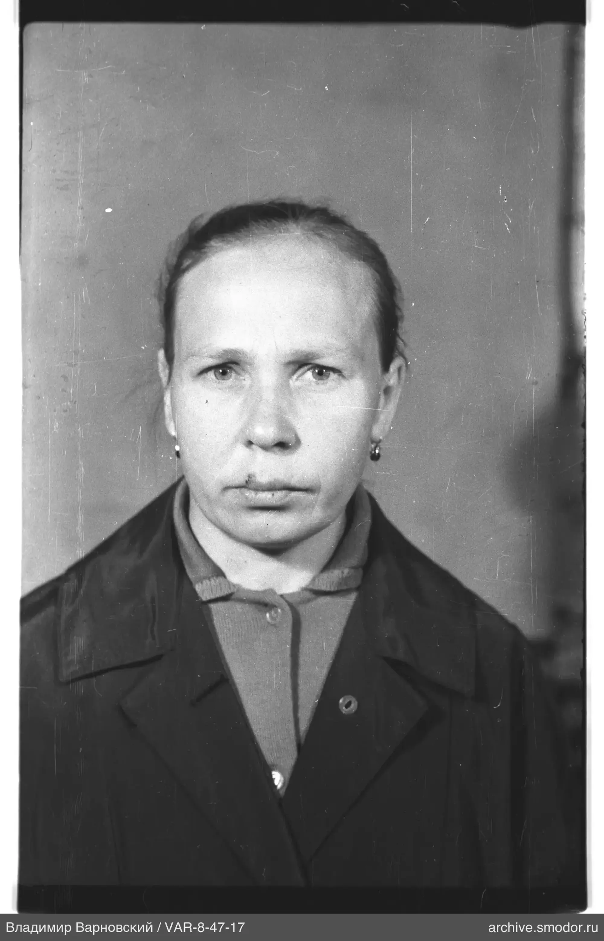 Portrait of a woman in a dark coat