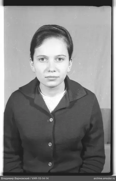 Portrait of a woman in a dark cardigan