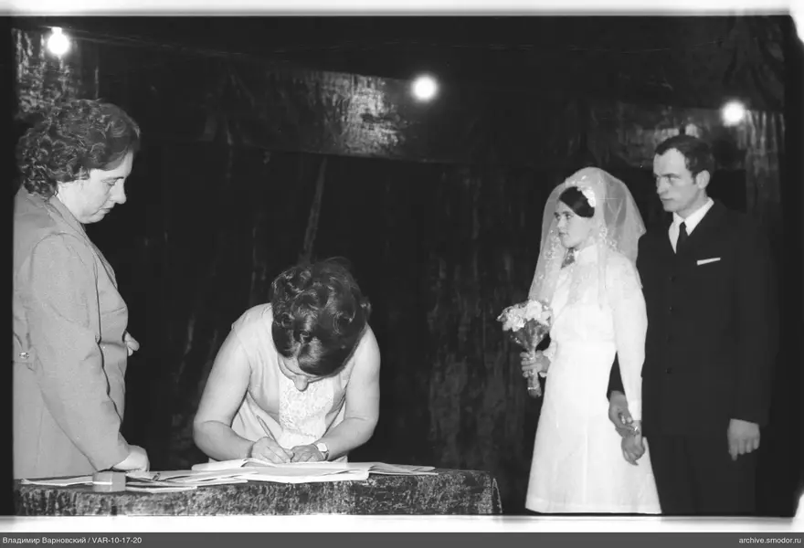 Wedding couple with women at the table