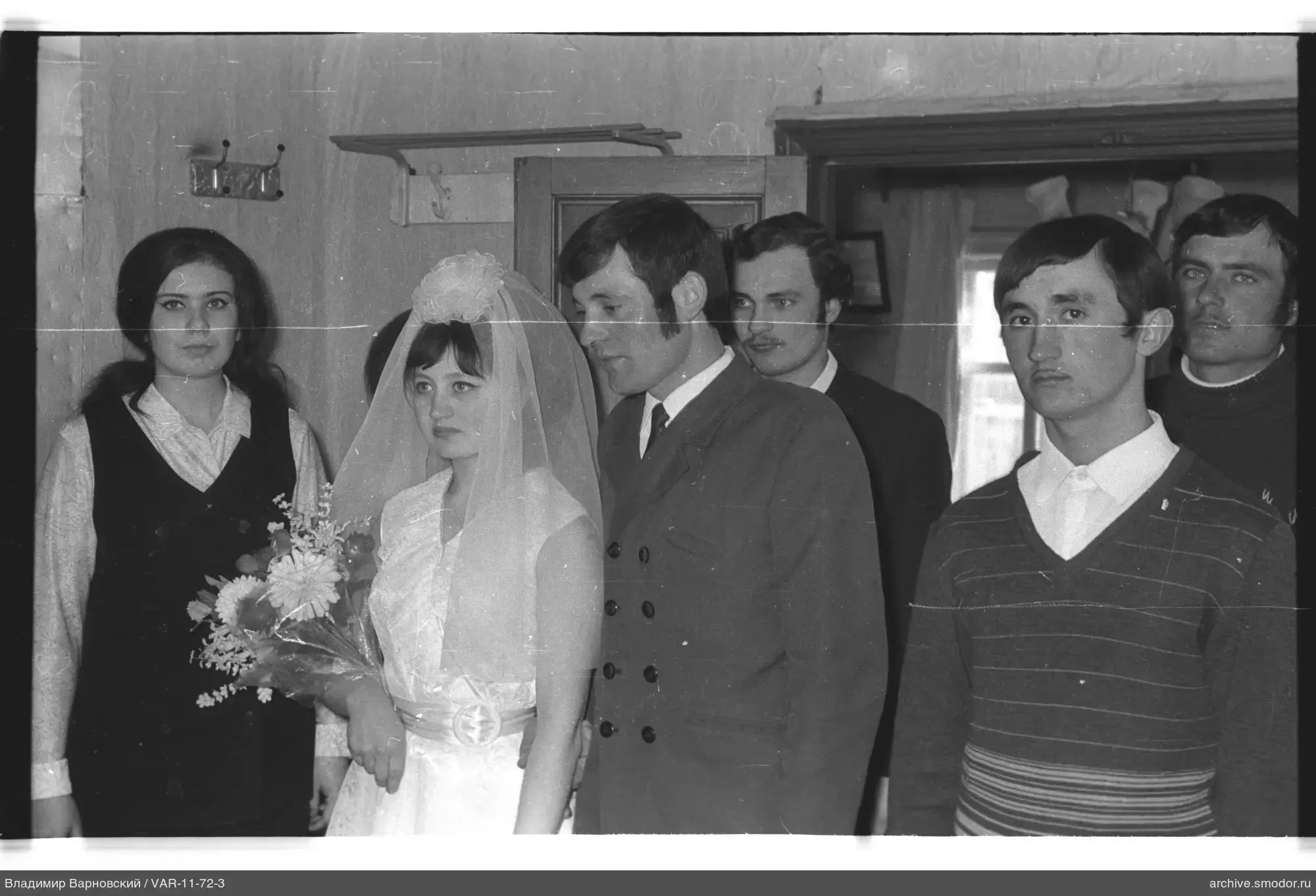 Group portrait with woman in wedding dress