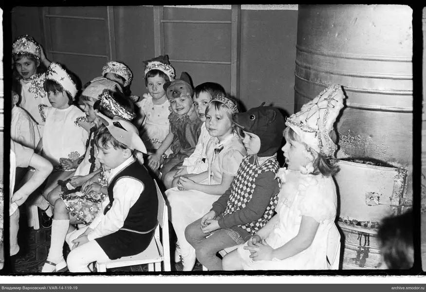 Children in costumes and festive headwear