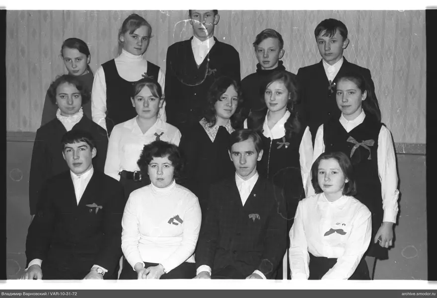 Group portrait with badges and patterned background
