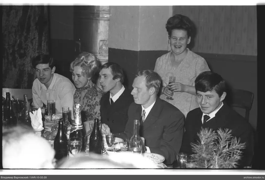 Group at the table with a spruce branch