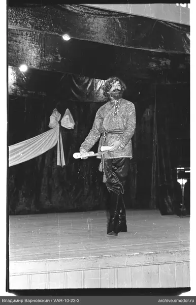 Man on stage with scroll