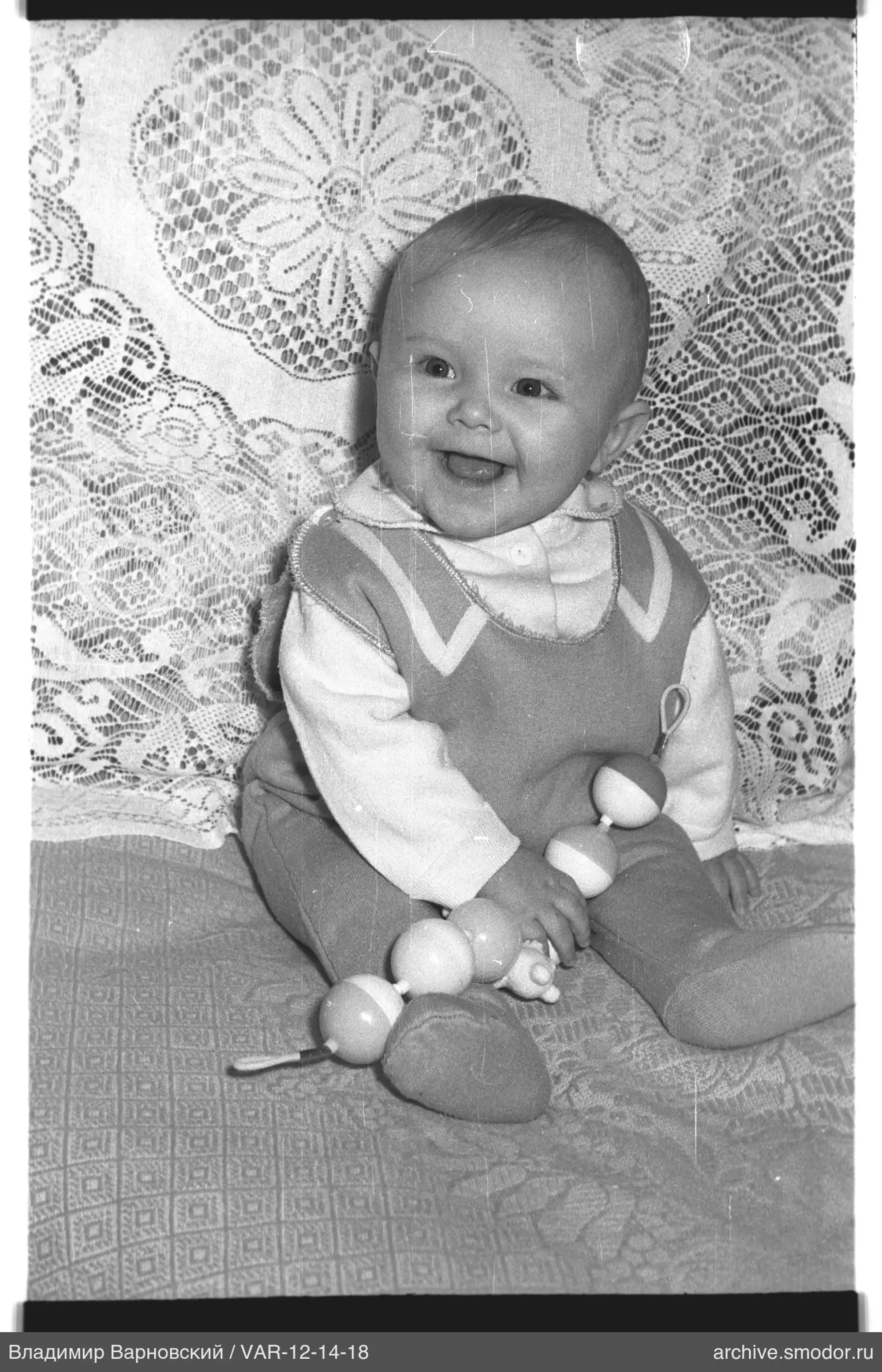 Child with toy on sofa