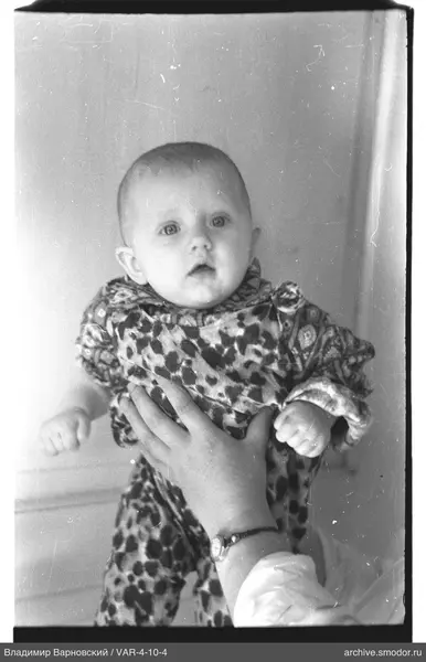 Child in overalls with pattern