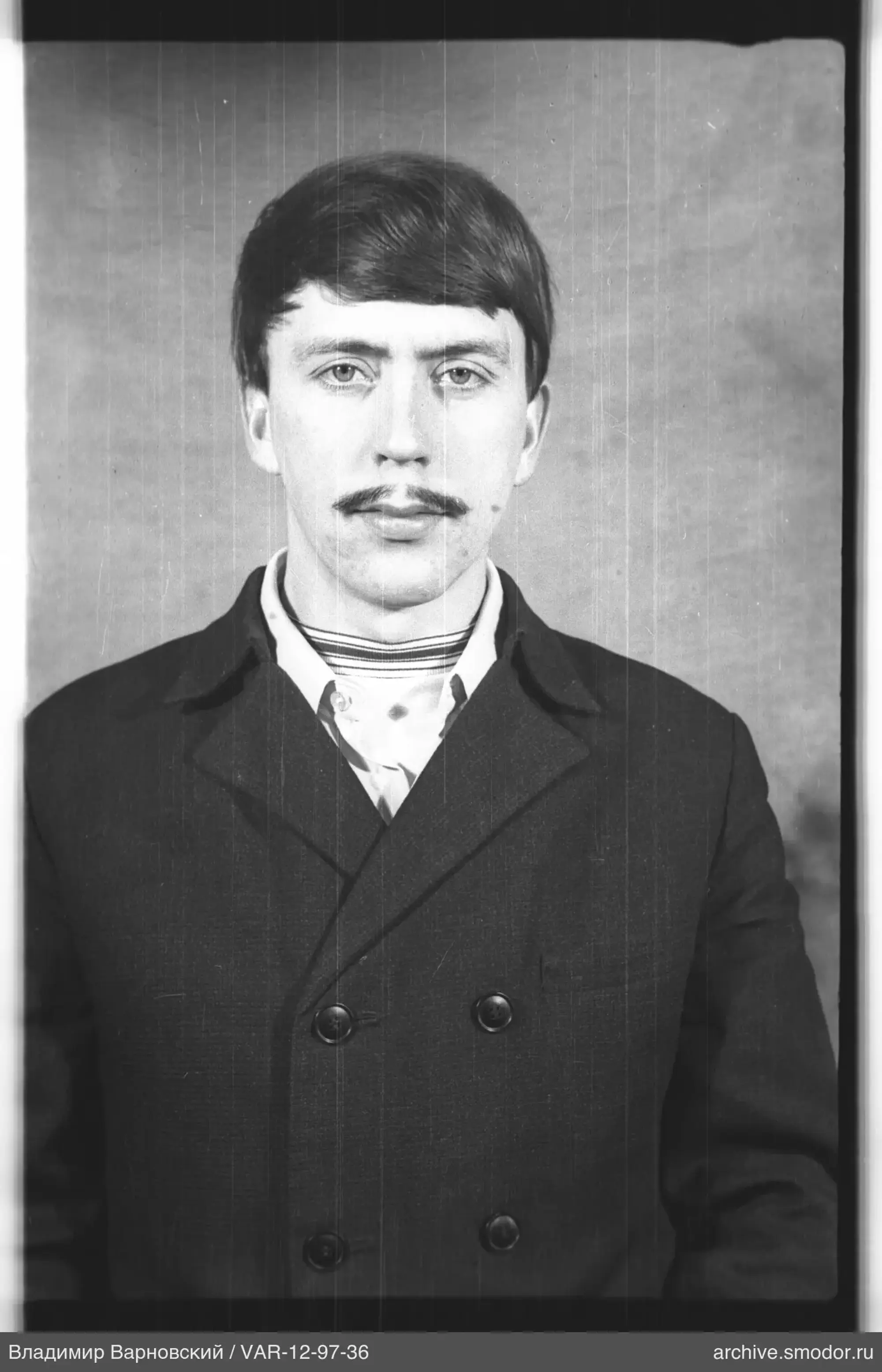 Portrait of a man in coat and turtleneck