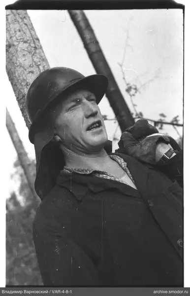Portrait of a man in helmet and dark clothing