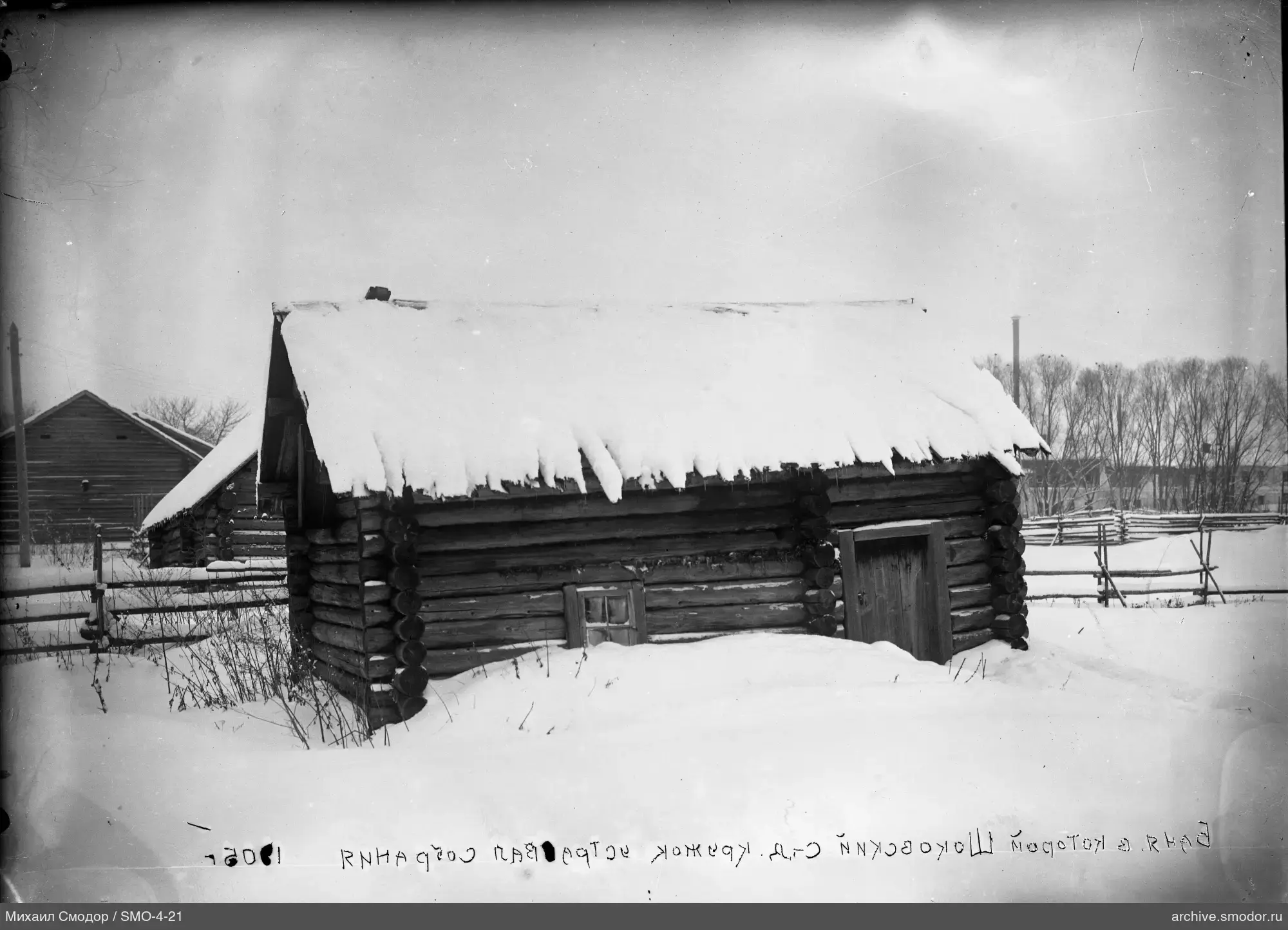 Holzblockhäuser im Schnee