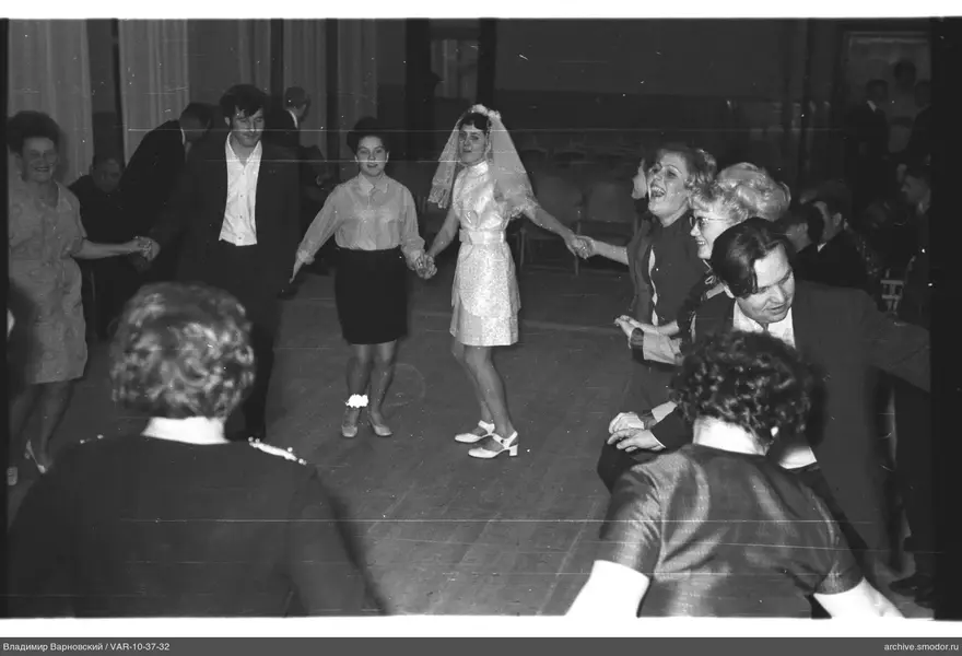 Circle of people with woman in center at event