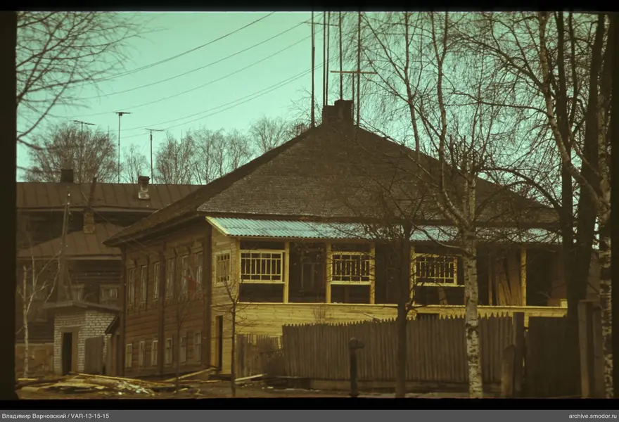 Two-story wooden building with veranda
