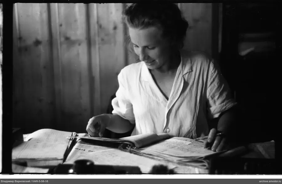 Woman with papers at the table