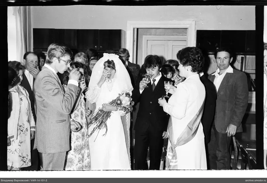 Group portrait with woman in wedding dress