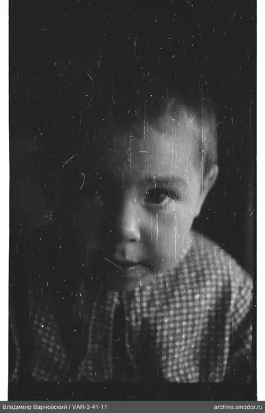 Child's portrait in a checkered shirt