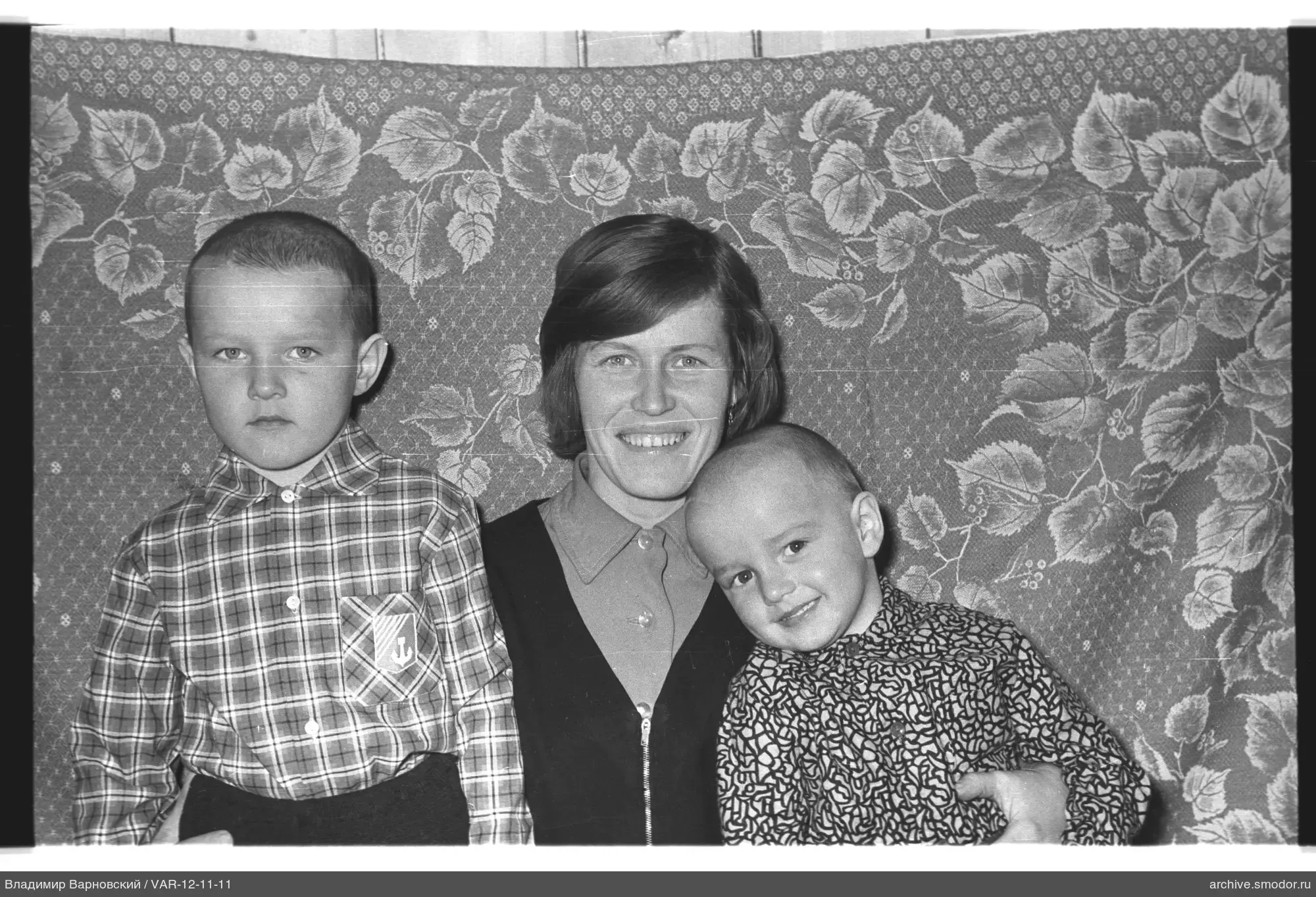 Group portrait with woman and two boys