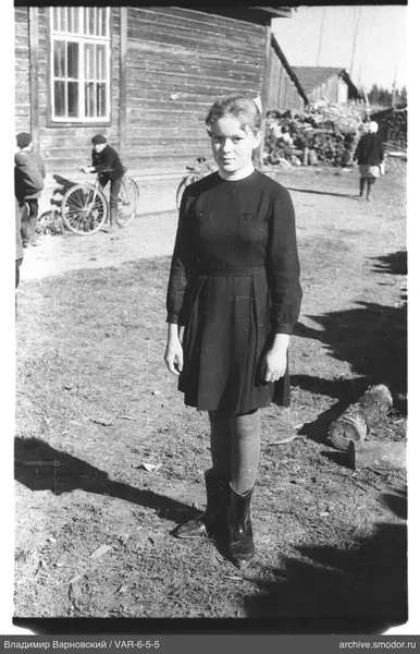Girl in dark dress with bow