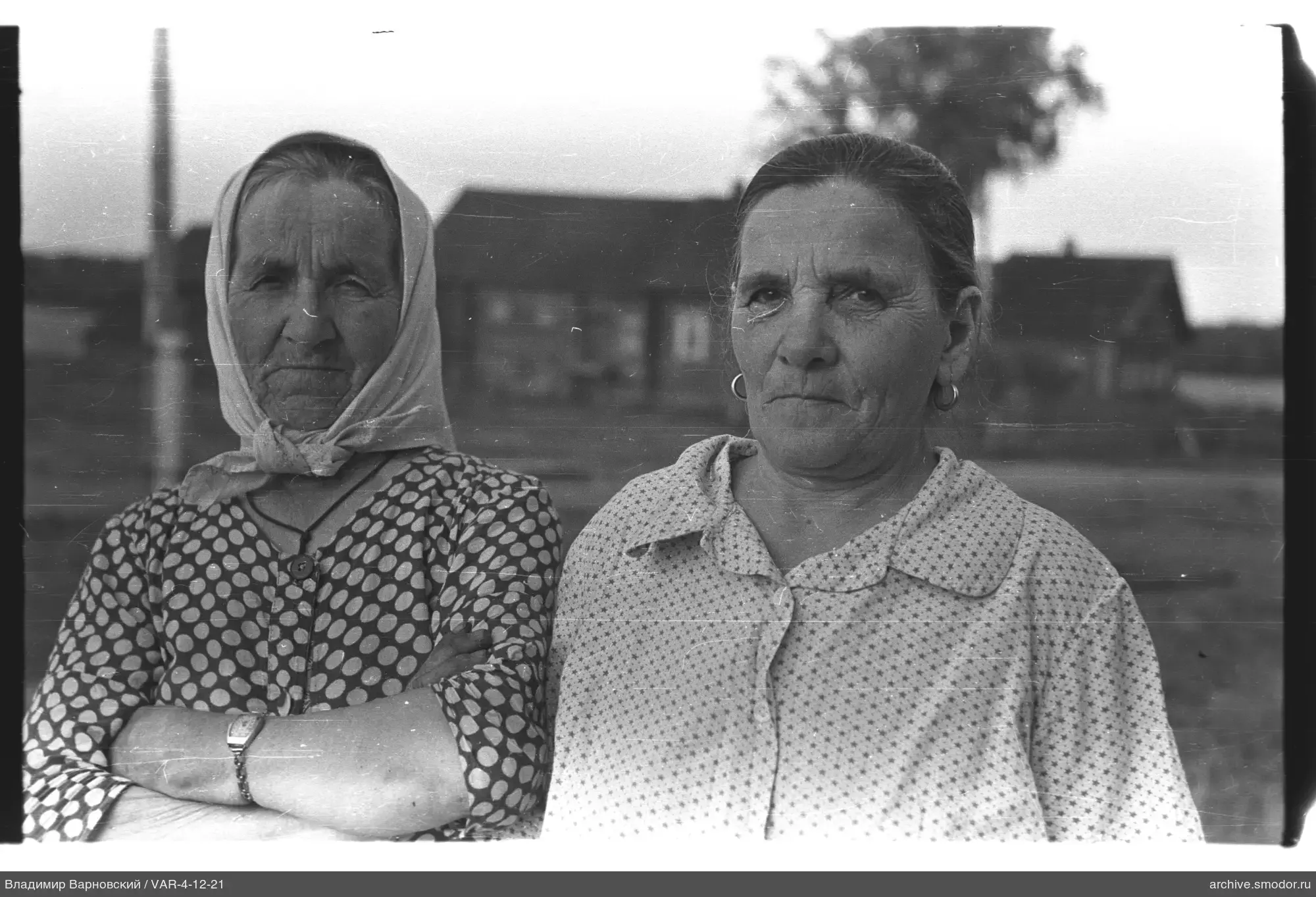 Two elderly women in a group portrait