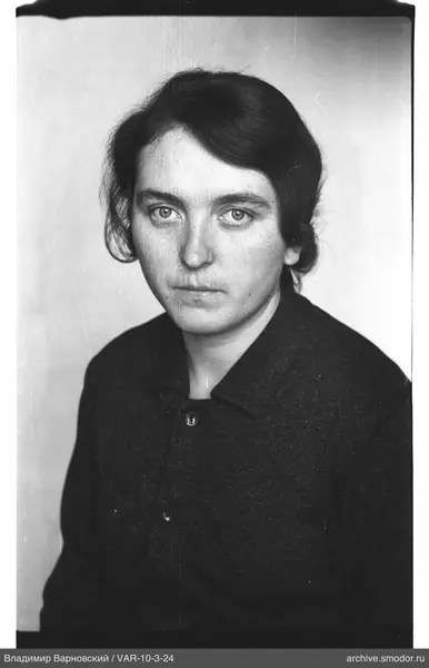 Portrait of a woman in a dark coat