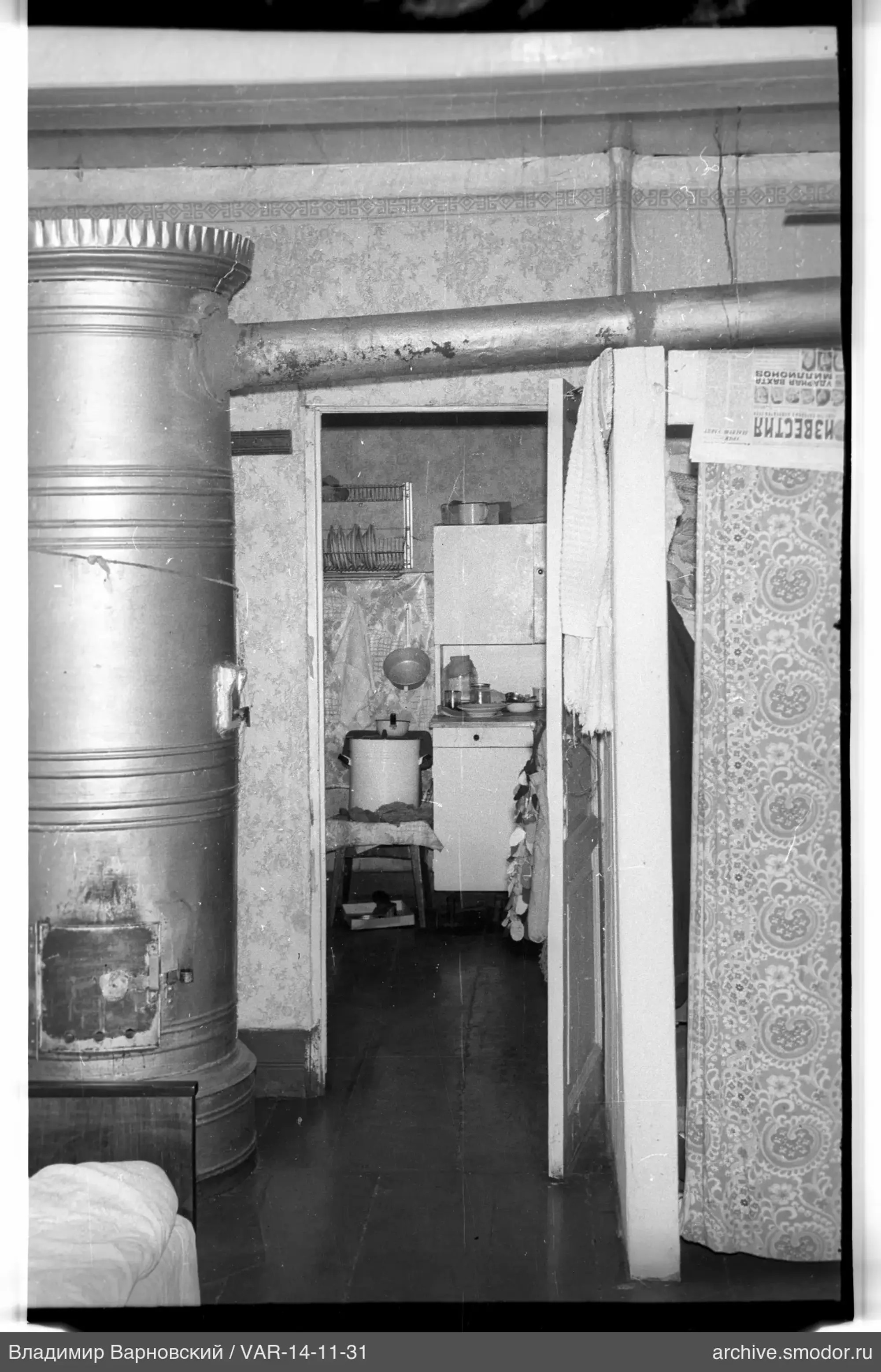 Kitchen with metal stove and open door