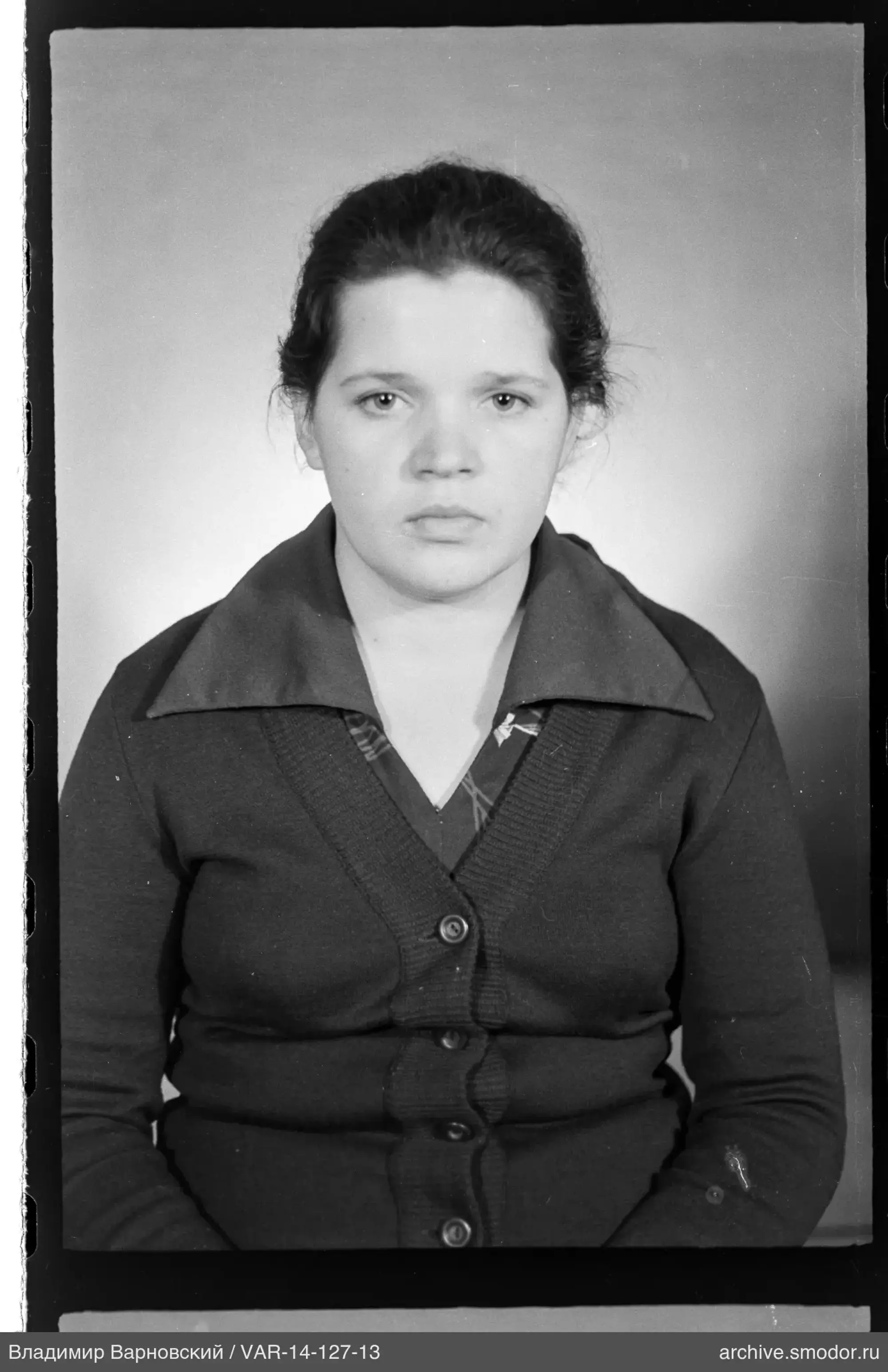Portrait of a woman in a dark cardigan