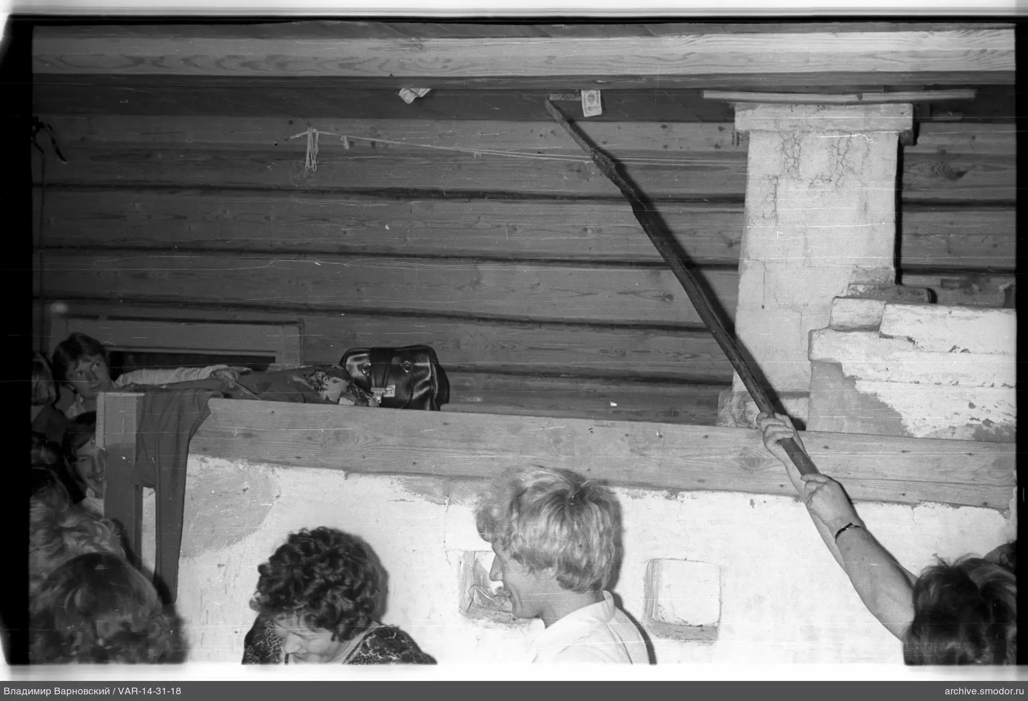 People inside a room with a stove