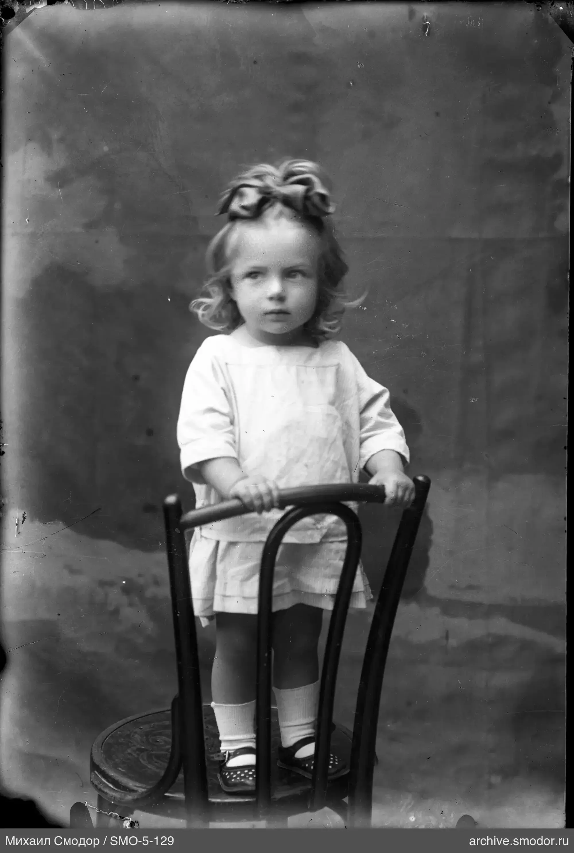 Girl with a large bow on her head