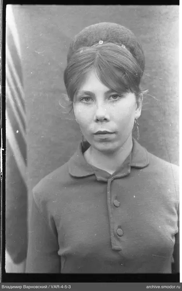 Portrait of a woman in a jacket and earrings