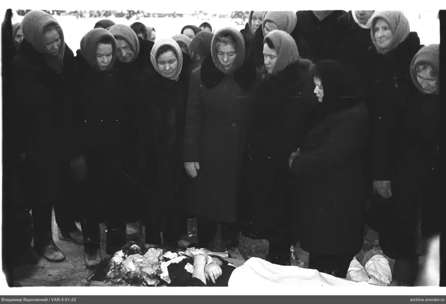 Group photo with body in foreground