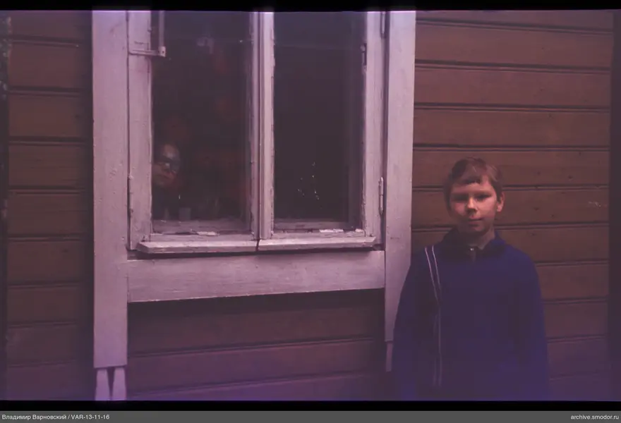Boy in blue sweater in foreground