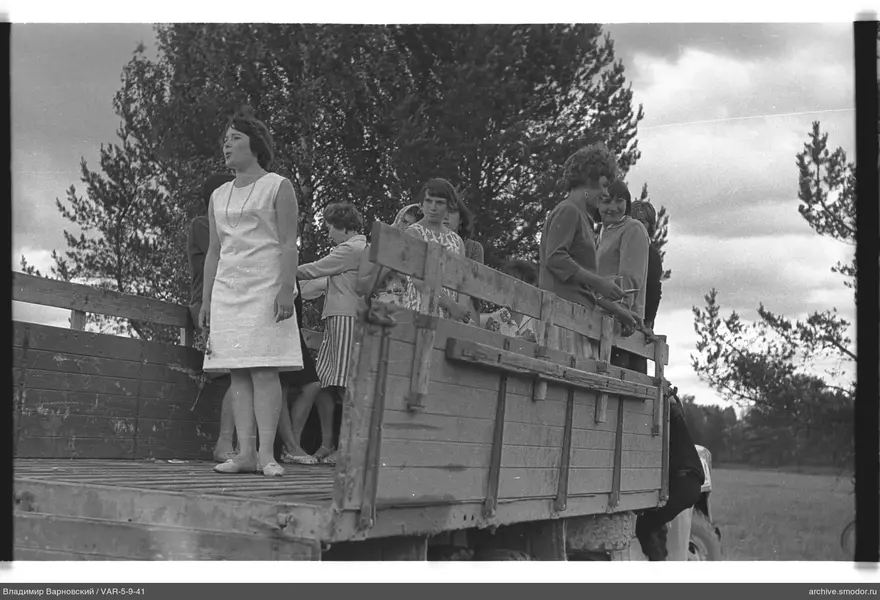 Women in truck bed outdoors